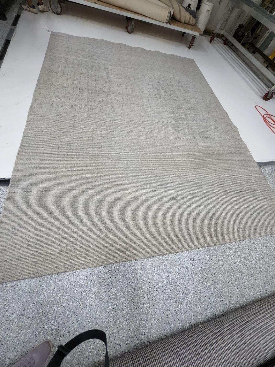 The same gray area rug after cleaning